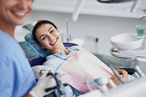 Smiling, happy patient in treatment chair