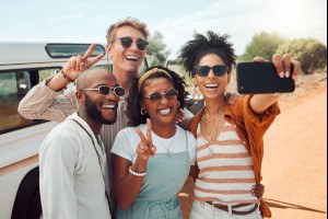 Happy friends taking a selfie together